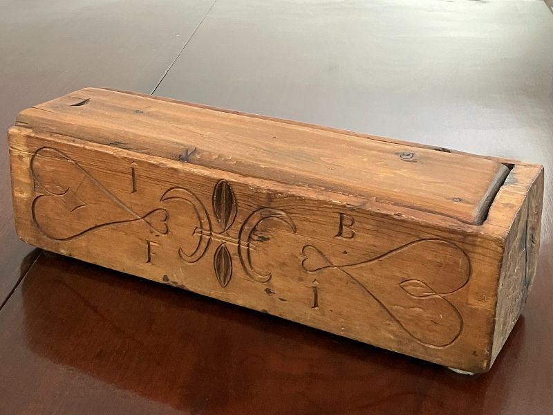 A Rare Pennsylvania Dutch Folk Art Carved and Hollowed Pine Candle Box