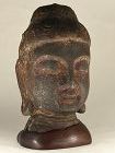 Chinese cast iron head of Buddha, probably Song dynasty, on old stand