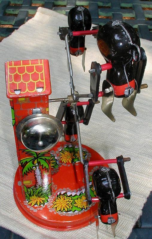 Late 1950's Metal Black Golliwog Windup Merry-Go-Round