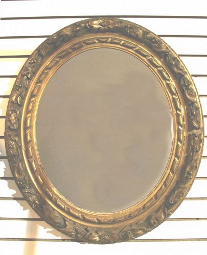 Antique Carved And Gilt Wood Oval Mirror