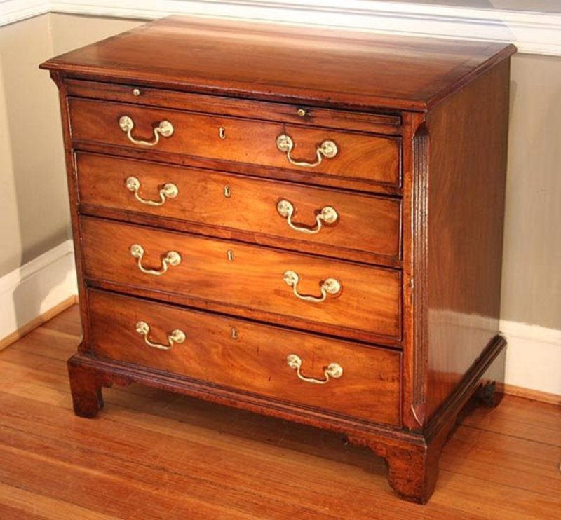 Lot - A George III mahogany bachelors chest the cross banded