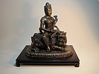 A 19th C. Chinese Bronze Quanyin Sitting On A Foo Lion