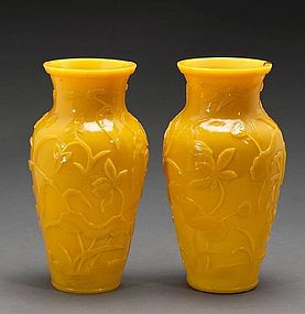 A pair of yellow Peking glass baluster vases