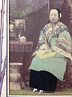 Old Chinese photo of a lady with lily lotus shoes