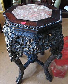 A rosewood flower stand with marble inset