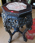 A rosewood flower stand with marble inset