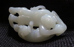 A nephrite white jade boy with a badger toggle Hetian