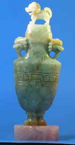 An archaistic jadeite covered vase with Foo Dog lid