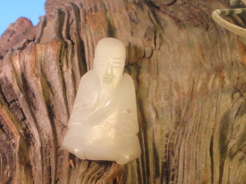 Antique Chinese white jade carving of a longivity god