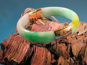 Jade bangle with 14 K gold fitting