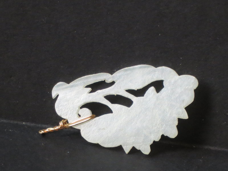 white jade carved pendant