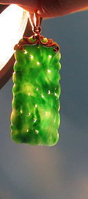 Carved Burma jadeite pendant with yellow gold loop