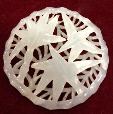 Reticulated white jade circle plaque with bamboo motif