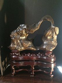 Large Chinese scholar's rock with double carved rosewood base