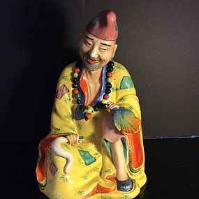 Famille Rose enamelled porcelain figure of Ji Gong