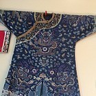 An embroidered blue silk Kesi dragon robe