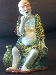 Famille Rose enamelled porcelain figure of a fishman