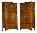 A pair of massive mix wood compound cupboards
