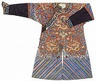 An embroidered russet silk ground dragon robe