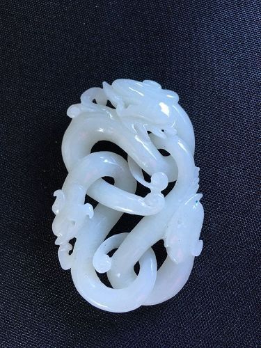 carved white jade dragon pendant