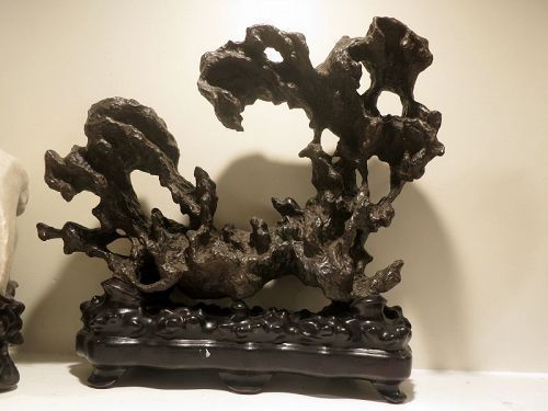 Scholar's rock with carved rosewood base
