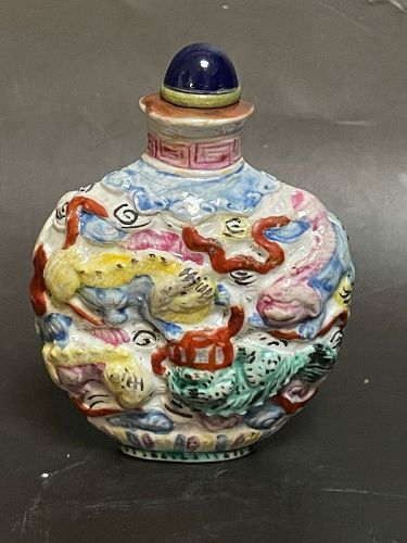 Chinese aantique molded porcelain polychrome Foo dog snuff bottle