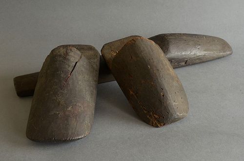 Three wooden lasts of straw boots