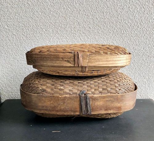 TWO LIDDED WILLOW BASKETS
