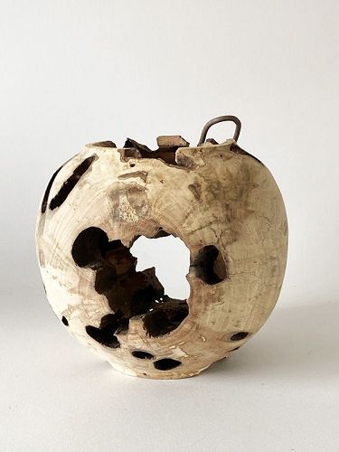 DECAYING WOODEN BALL
