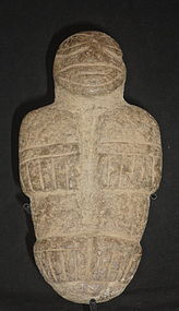 A DIQUIS STANDING STONE MALE DEITY OR WARRIOR