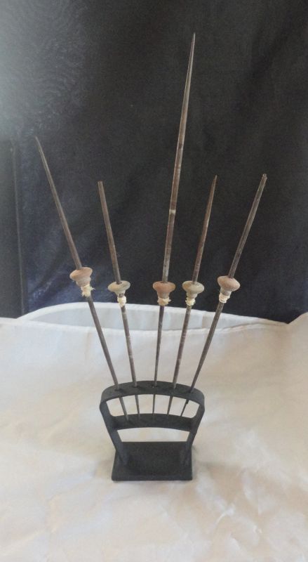 FIVE PRE-COLUMBIAN WEAVING INSTRUMENTS MOUNTED ON A HEAVY METAL BASE