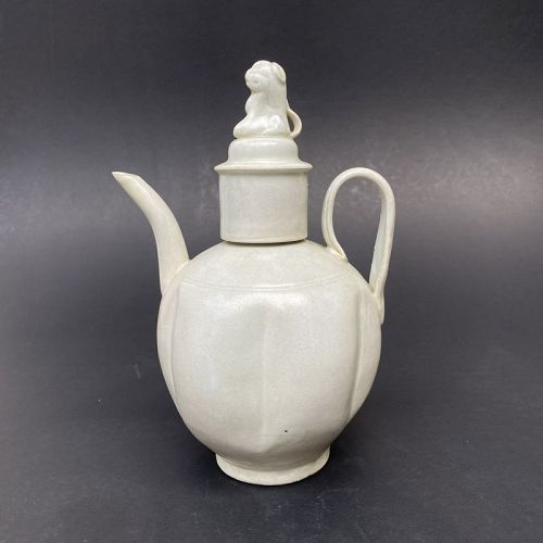 A Song Dynasty White Glazed Ewer with Lion Cover.