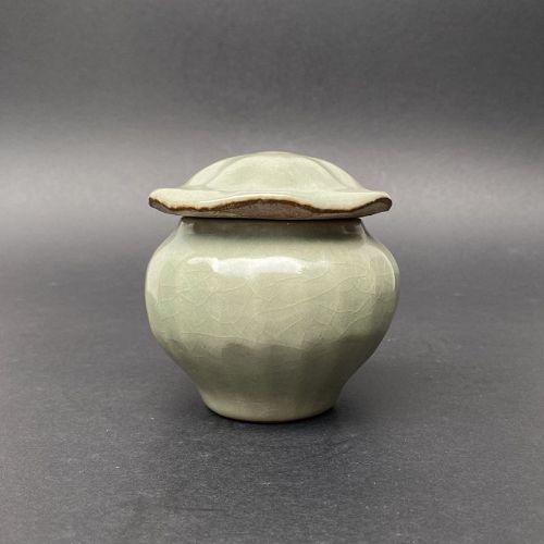 A Chinese Yuan Dynasty Ribbed Celadon Jar and Cover