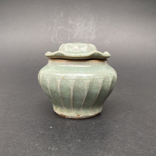 A Yuan Dynasty Celadon Glazed Ribbed Jar.