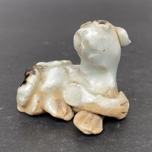 A Yuan Dynasty Qingbai Glazed Figure of a Dog with Iron Spots