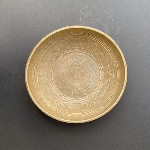 A Large Six Dynasties Yue Celadon Bowl with Carved Decoration