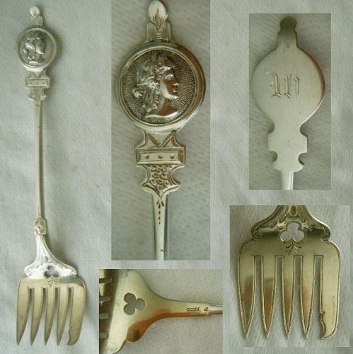 Applied "Medallion" Coin Silver Sardine Fork