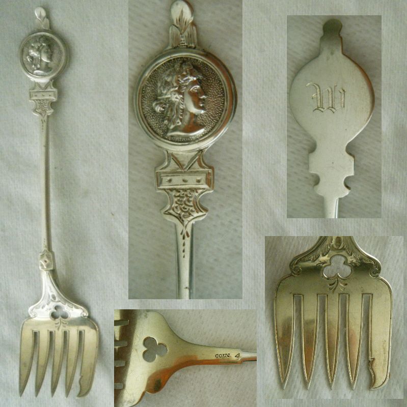 Applied &quot;Medallion&quot; Coin Silver Sardine Fork