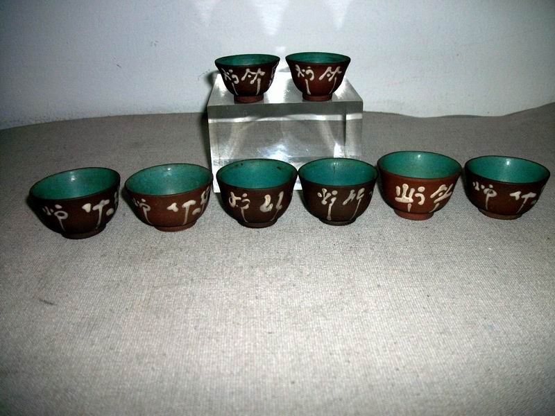 A GROUP OF YIXING TEA CUPS