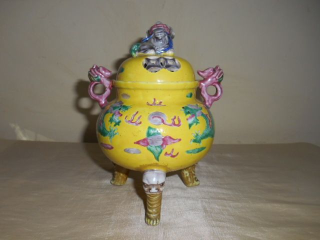 A YELLOW-GROUND FAMILLE ROSE TRIPOD CENSER
