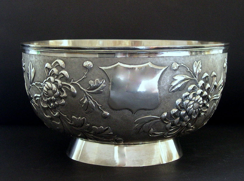 Chinese silver bowl by yok sang and flowers embossed