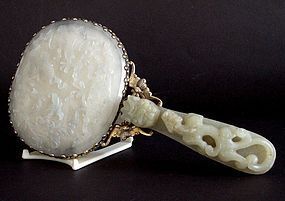 Chinese 19 C. jade plaque and belt hook mounted on a mirror