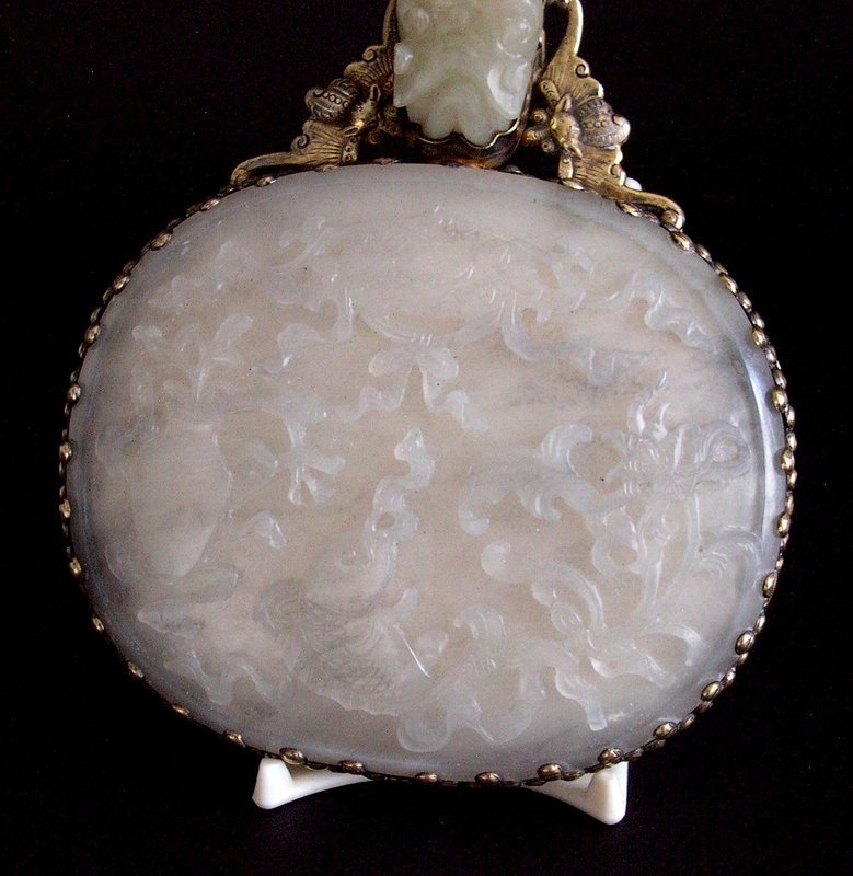 Chinese 19 C. jade plaque and belt hook mounted on a mirror