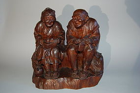 Wood sculpture, farmer and wife with tea kettle and tonkotsu, Japan