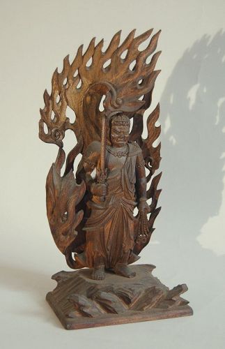Wooden sculpture of Fudo Myoo surrounded by flames, Japan