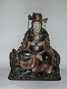 Sitting Shichimen Daimyojin, wood, Japan, 19th c.