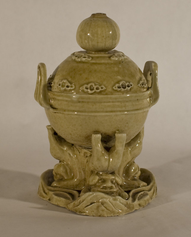 Chinese antique porcelain oil lamp with foo dogs holding the vessel