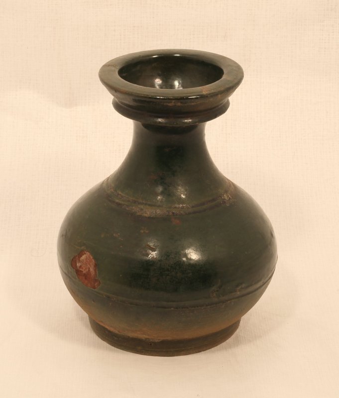 Chinese Han Dynasty Hu form vase in green glaze