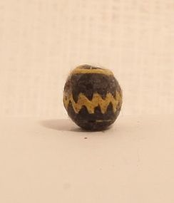 Ancient Islamic zig zag wound glass bead black and yellow 900-1100AD