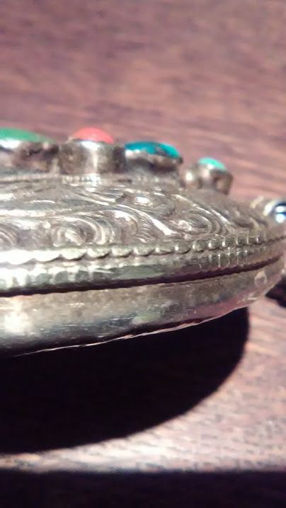 Tibetan Silver Repousse Buddhist Pendant with Turquoise and Coral